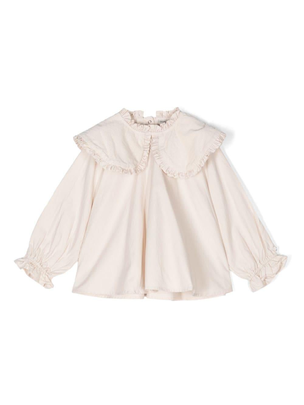 Blusa per bambina Donsje Mellys beige con dettagli ruches e colletto con pettorina - Rubino Kids