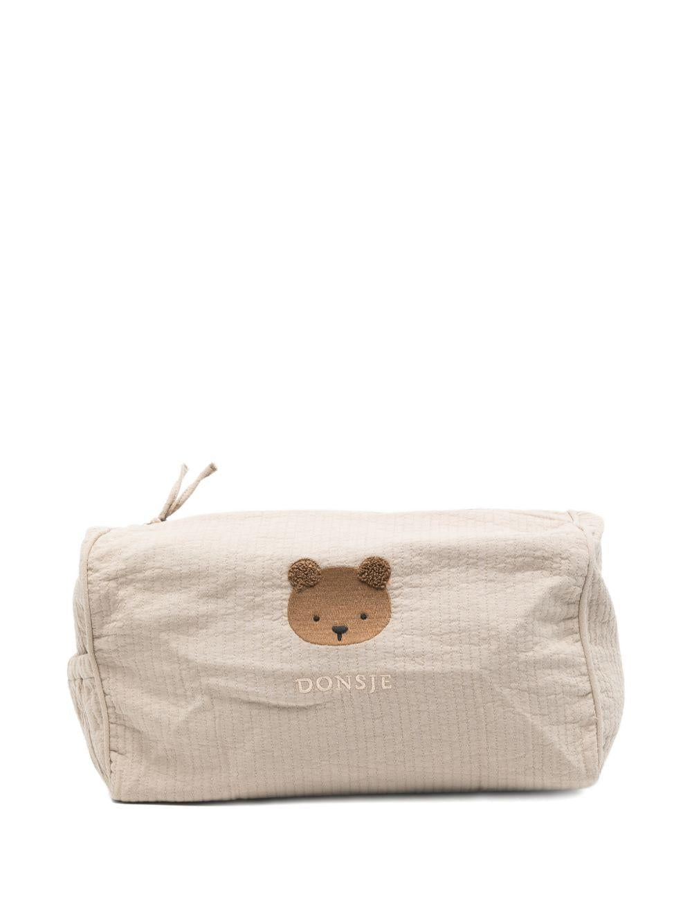Borsa da toilette per neonati Donsje beige con ricamo orsetto - Rubino Kids