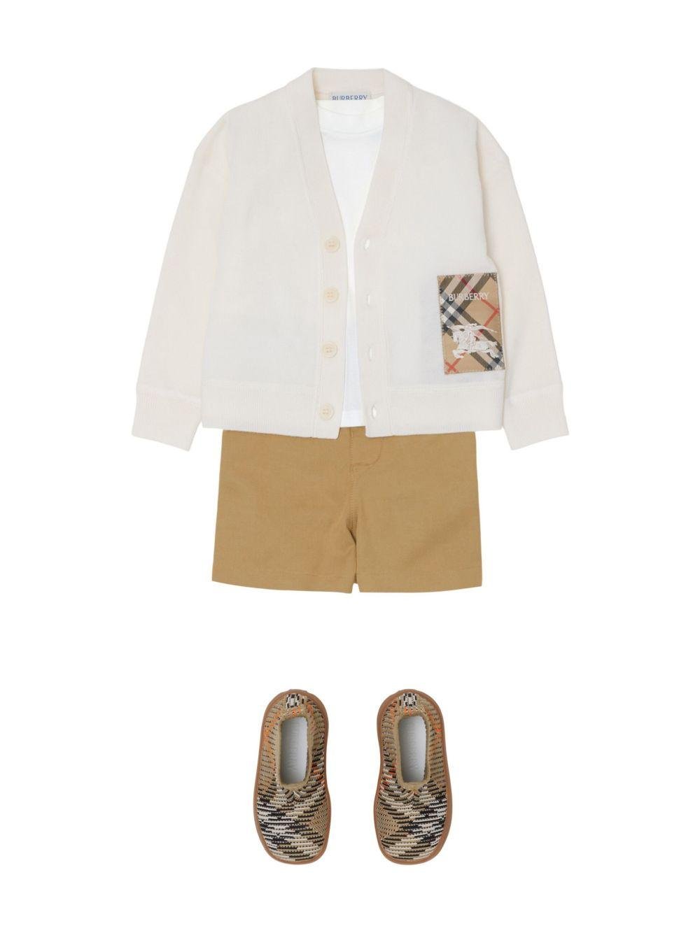 Cardigan per neonato Burberry Kids bianco in lana con applicazione logo - Rubino Kids