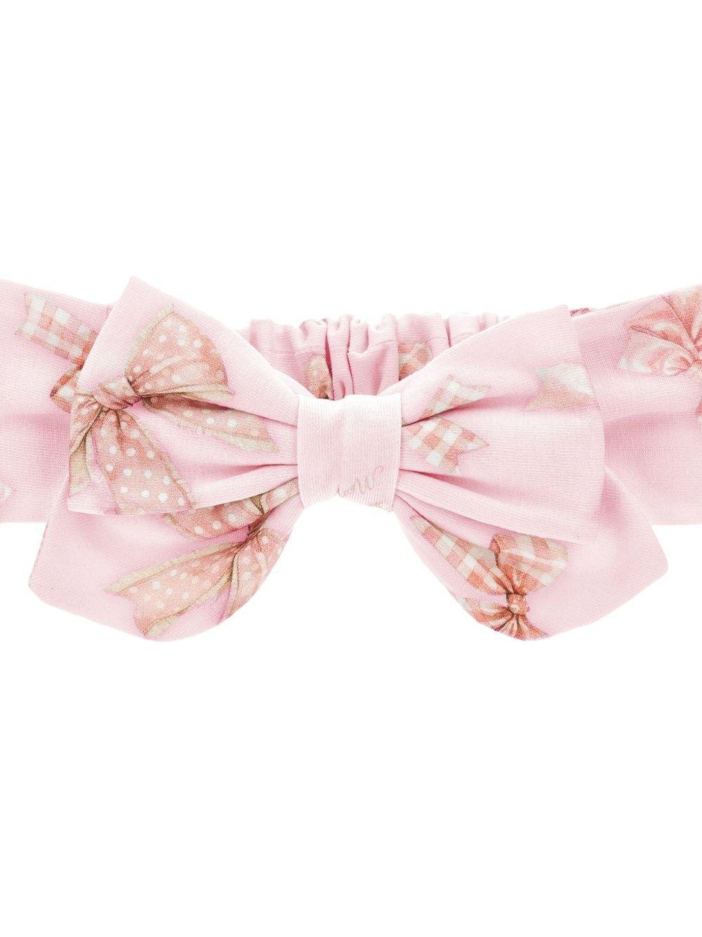 Fascia per capelli per neonata Monnalisa rosa con stampa grafica e dettaglio fiocco - Rubino Kids