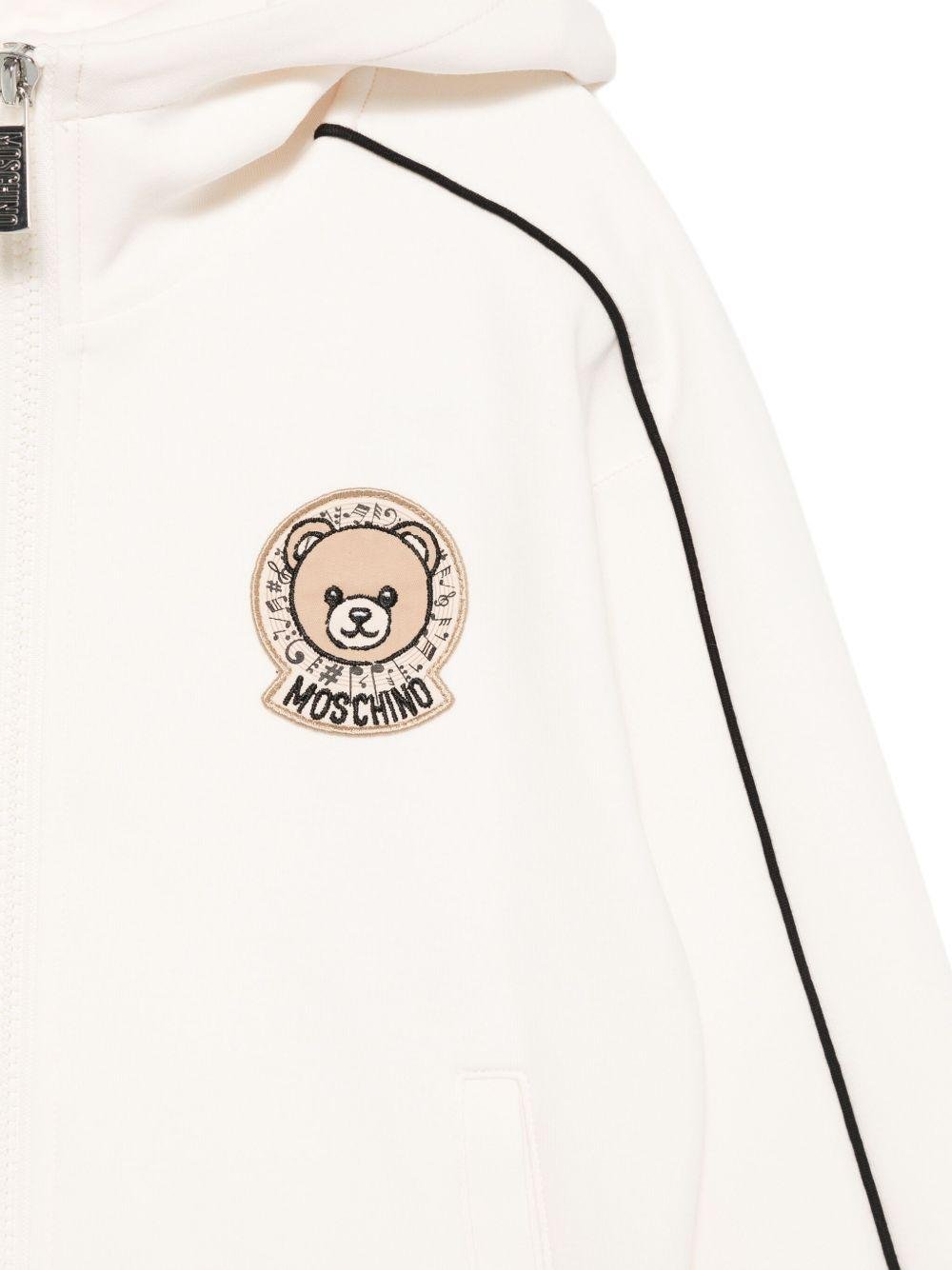 Felpa per bambini Moschino Kids bianco con cappuccio e zip con logo teddy - Rubino Kids