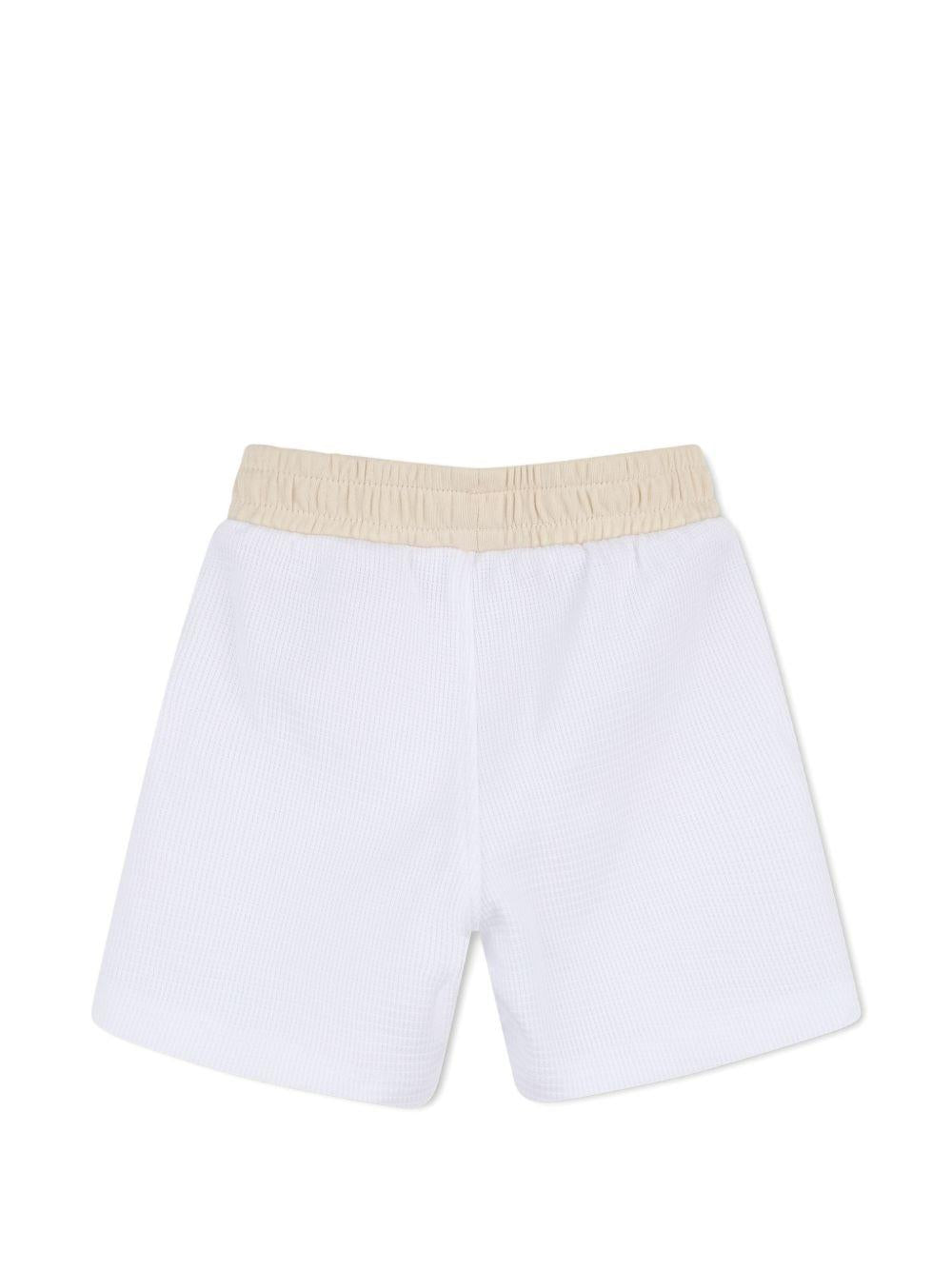 Set polo e shorts per neonato BOSS Kids bianco con logo J53047 10P BOSS KIDS
