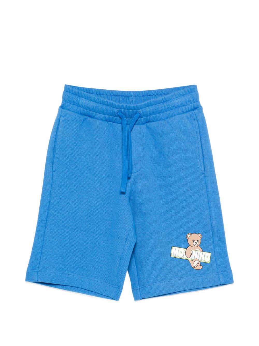 Shorts per bambino Moschino Kids azzurri con logo sul davanti HUQ02LLCA90 40630 MOSCHINO KIDS