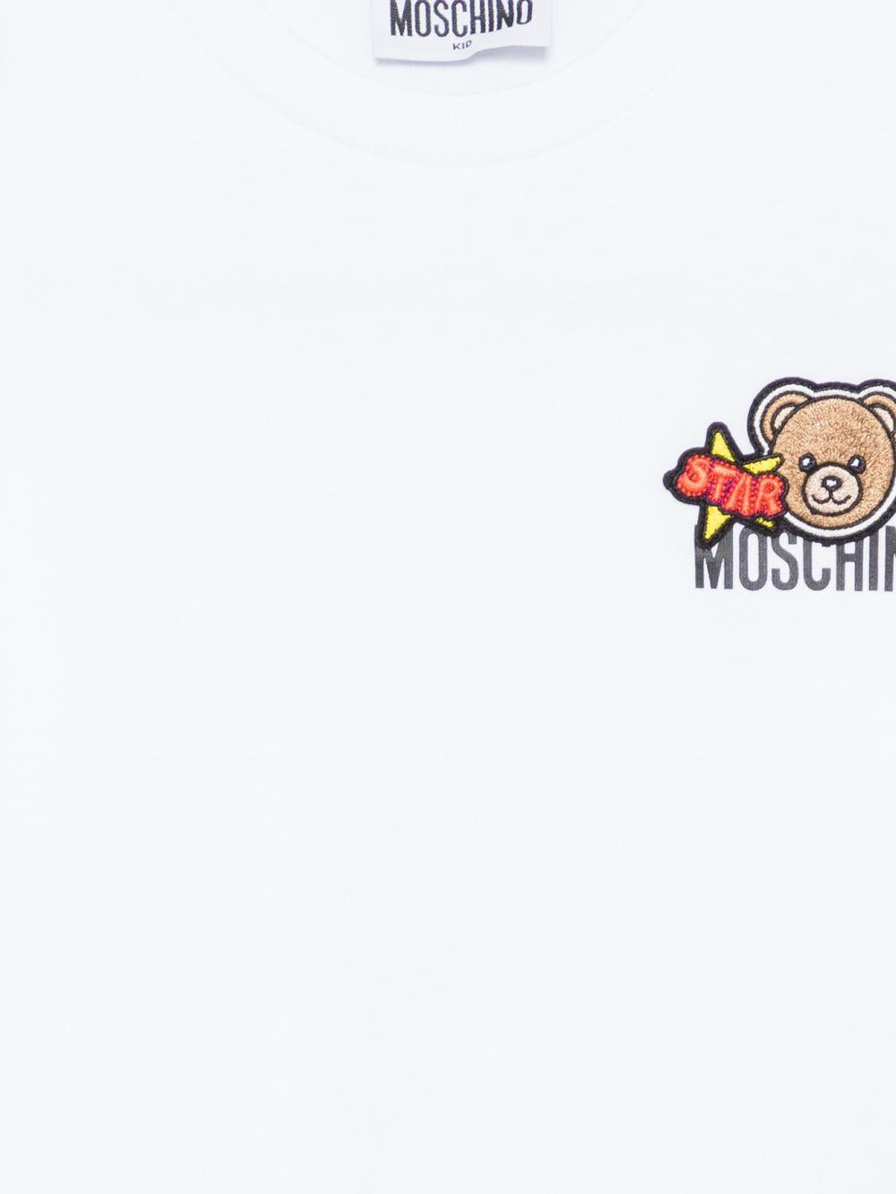 T-shirt per bambini Moschino Kids bianca con ricamo Teddy Bear HTM058LAA24 10101 MOSCHINO KIDS