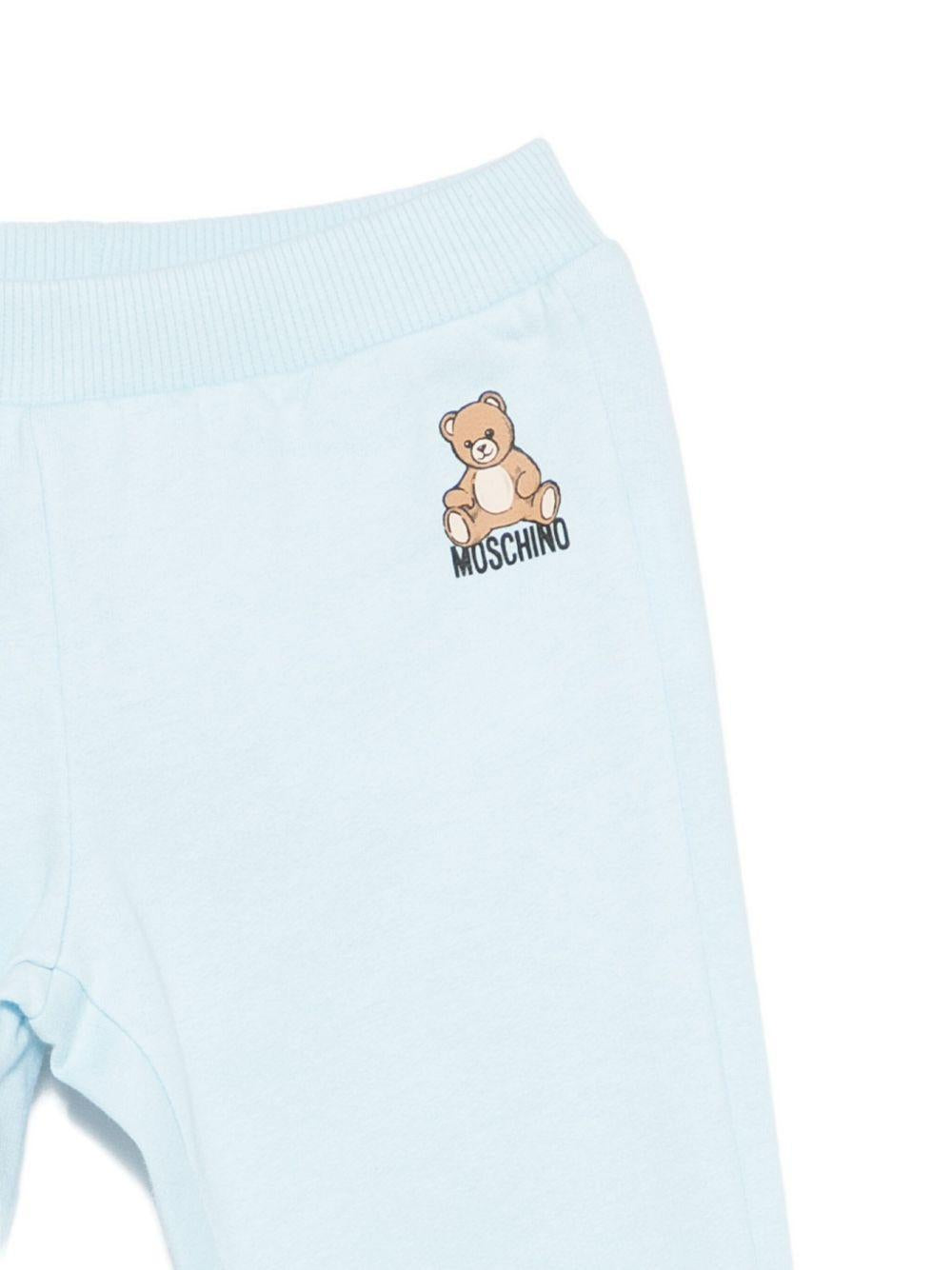 Tuta sportiva per neonato Moschino Kids azzurro con stampa Teddy Bear MMK05ELCA40 40304 MOSCHINO KIDS