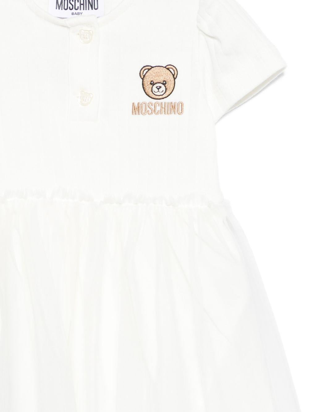 Abito per neonata Moschino Kids bianco con ricamo Teddy Bear MDV0DBLAA55 10063 MOSCHINO KIDS