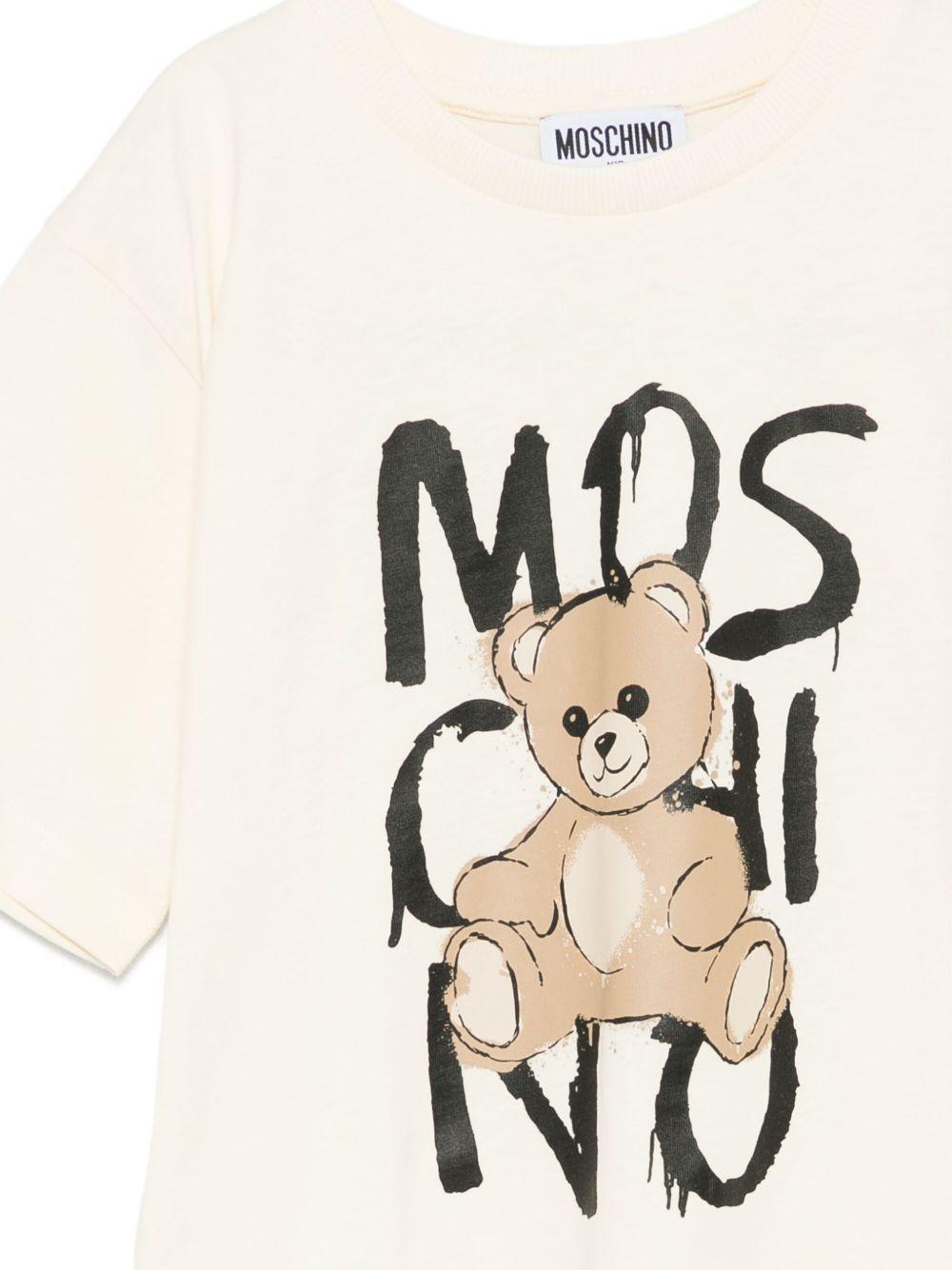 T-shirt per bambini Moschino Kids beige con stampa e logo HNM05GLAA20 10123 MOSCHINO KIDS