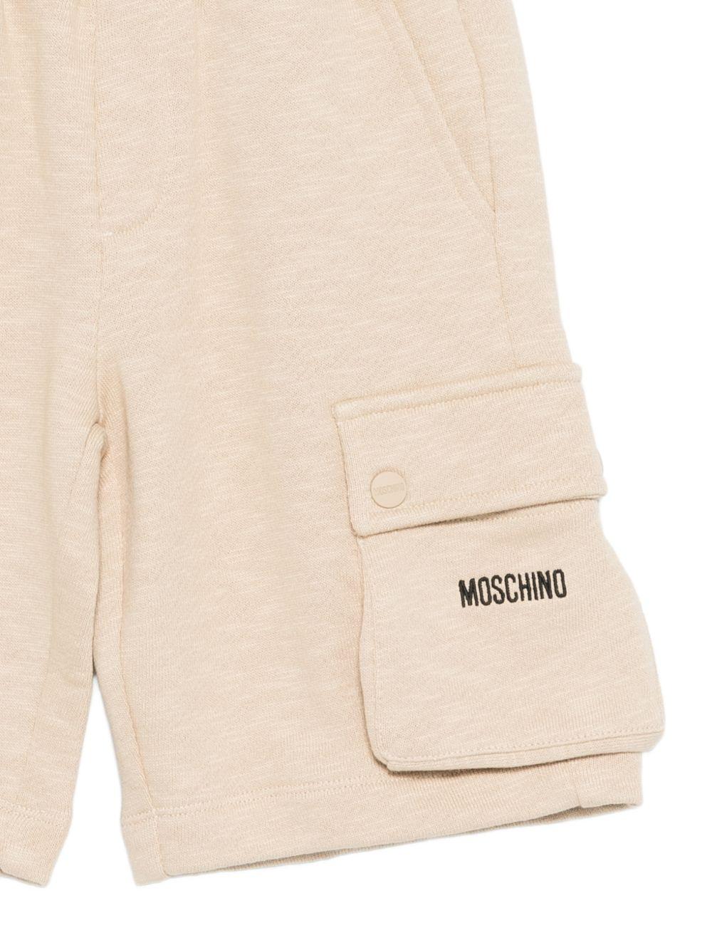 Shorts per bambino Moschino Kids beige con logo sul davanti HUQ02QLCA88 20829 MOSCHINO KIDS