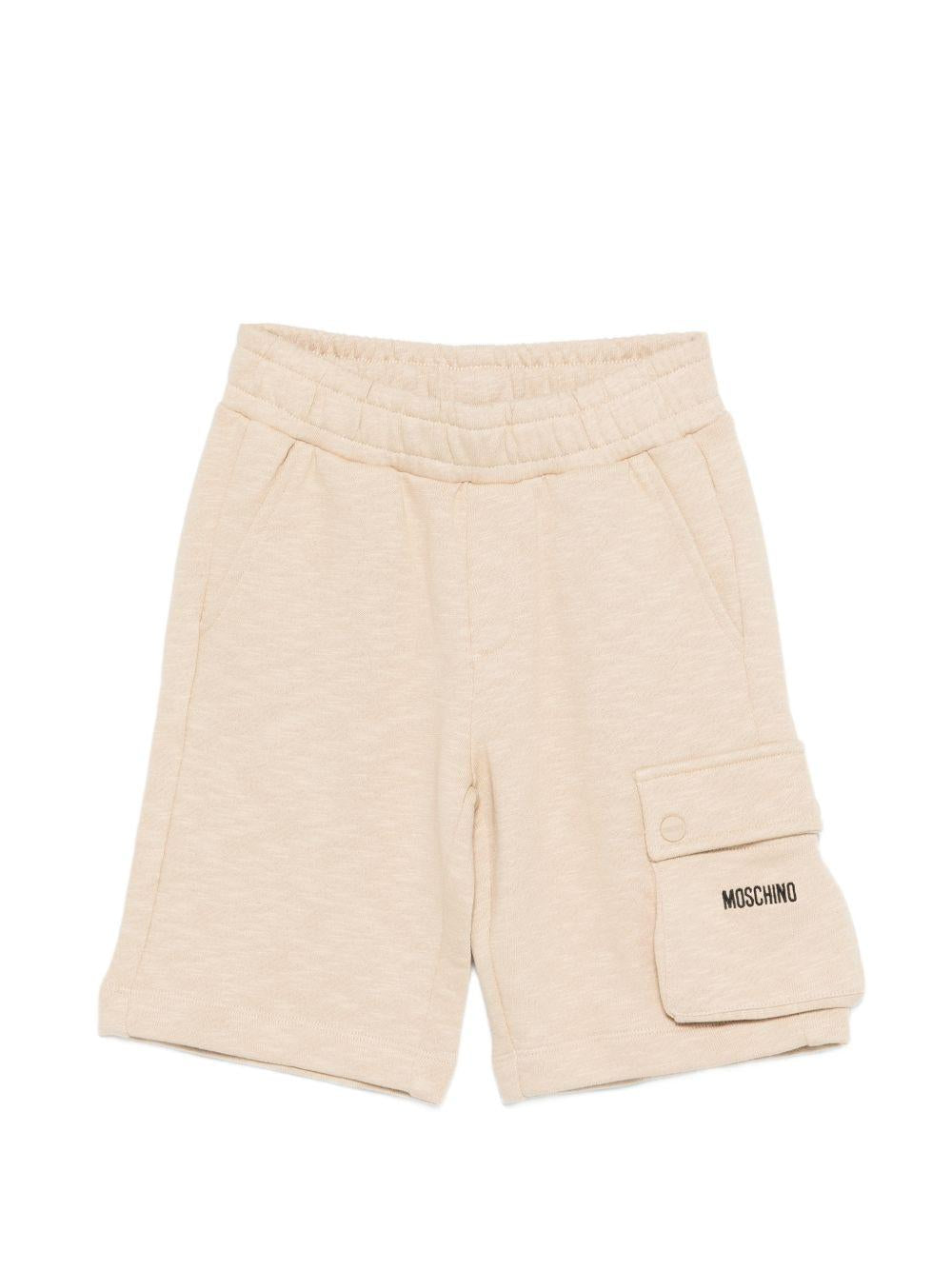 Shorts per bambino Moschino Kids beige con logo sul davanti HUQ02QLCA88 20829 MOSCHINO KIDS