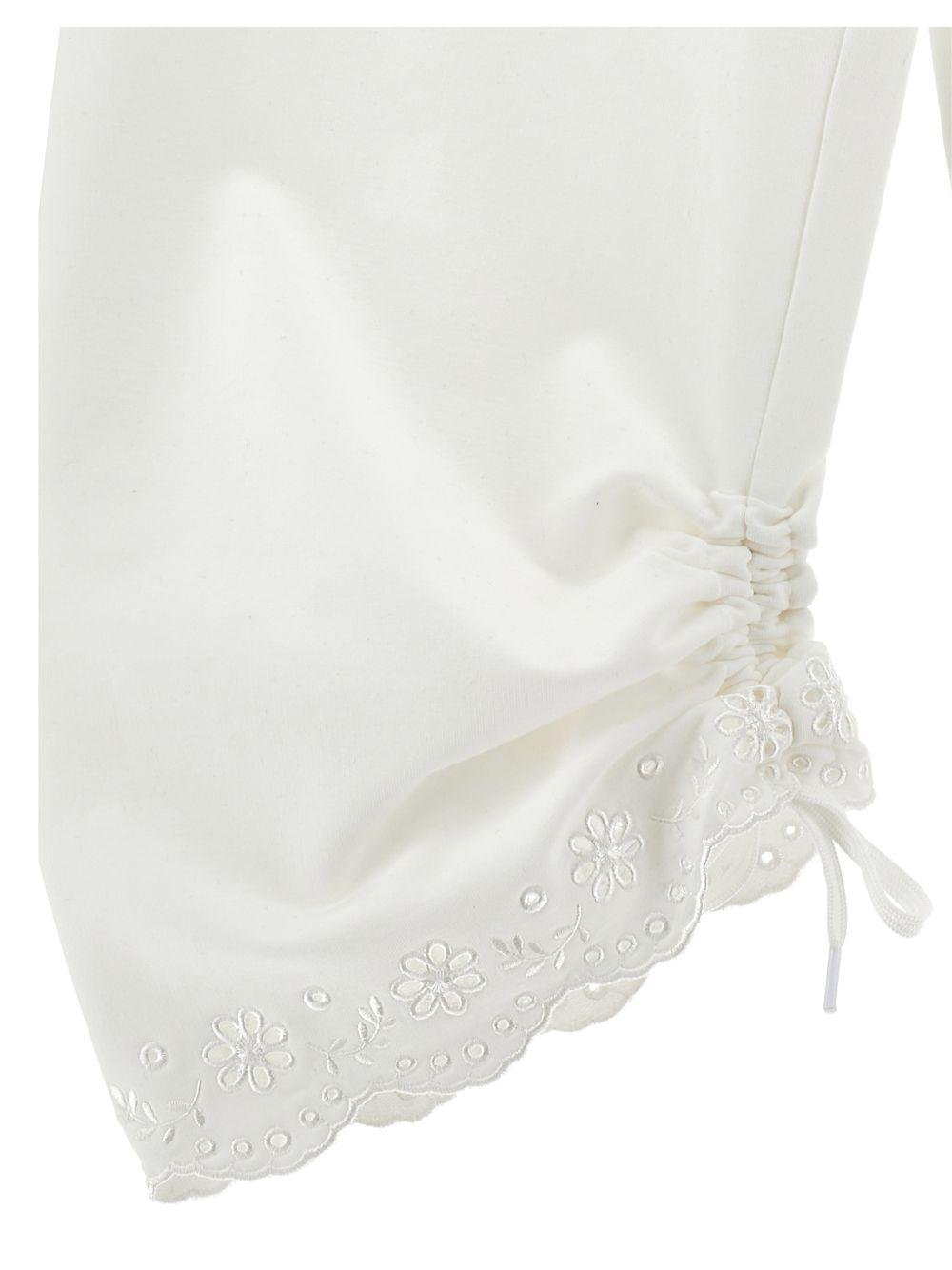 Pantaloni per bambina Monnalisa bianchi con ricamo a fiori - Rubino Kids