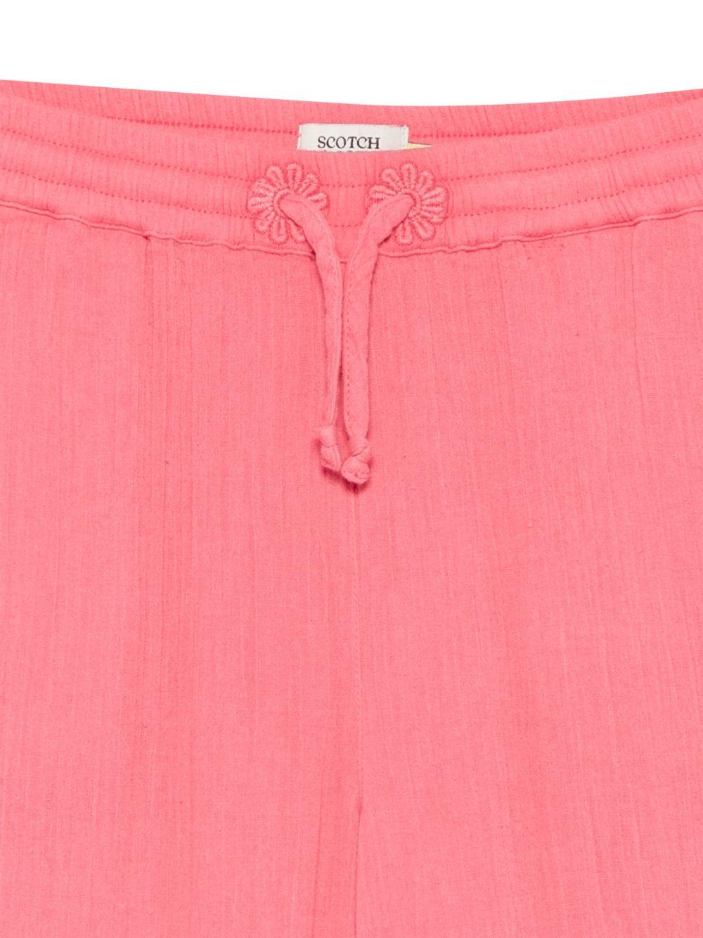 Pantaloni per bambina Scotch & Soda Kids rosa con effetto stropicciato - Rubino Kids