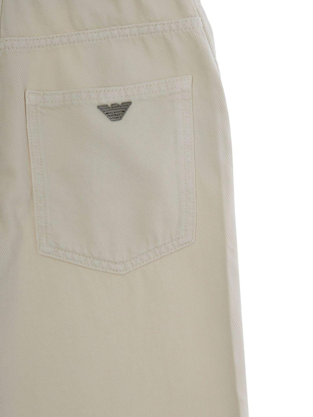 Pantaloni per bambino Emporio Armani Kids beige con tasche applicate - Rubino Kids