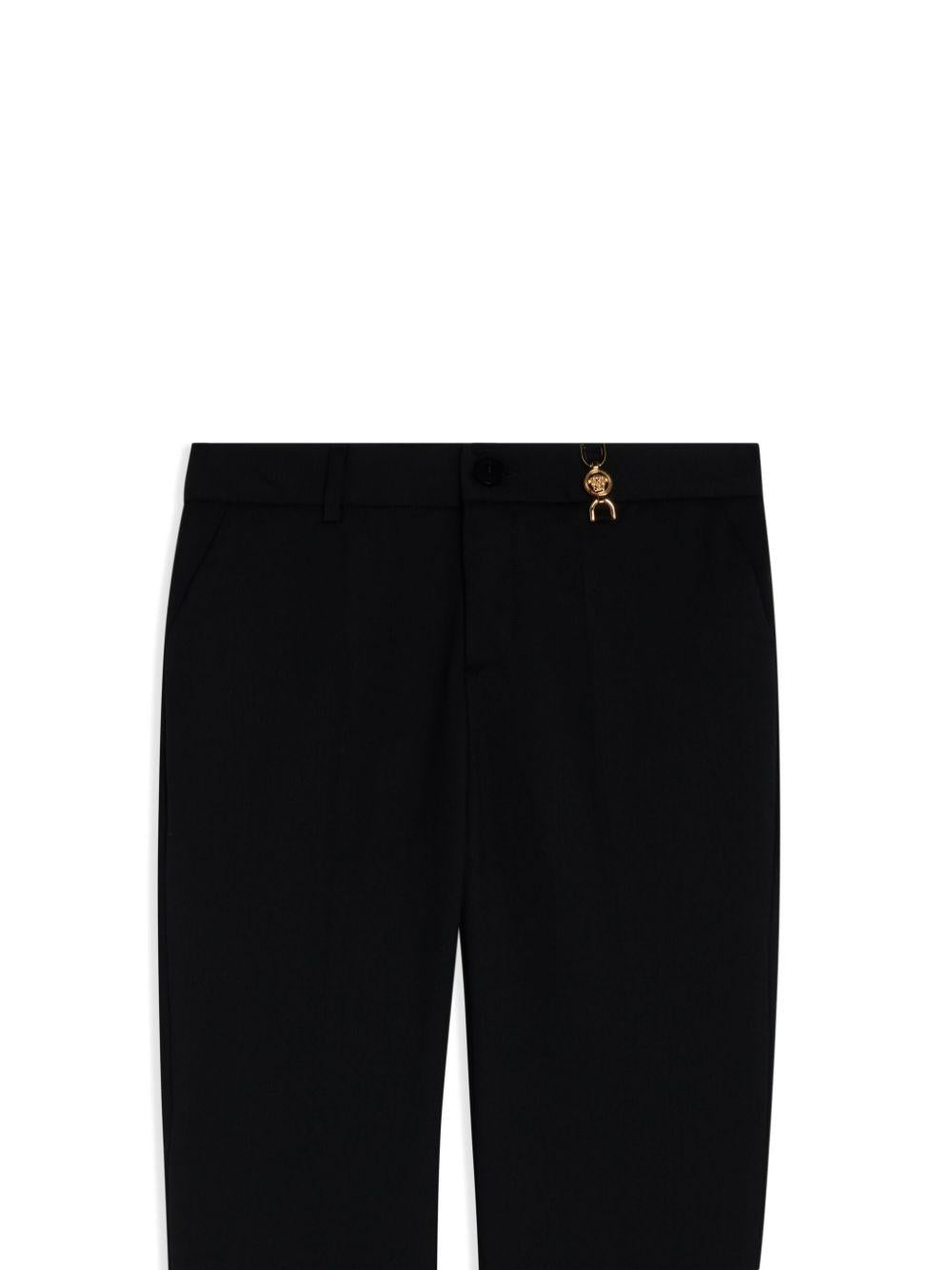 Pantaloni per bambino Versace Kids nero con placca Medusa - Rubino Kids