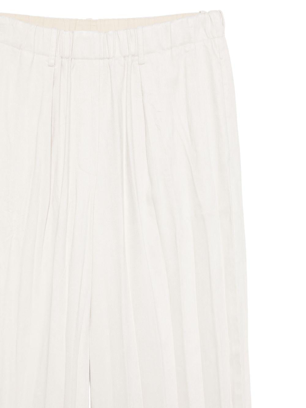 Pantaloni per donna Alysi beige con design plissettato - Rubino Kids