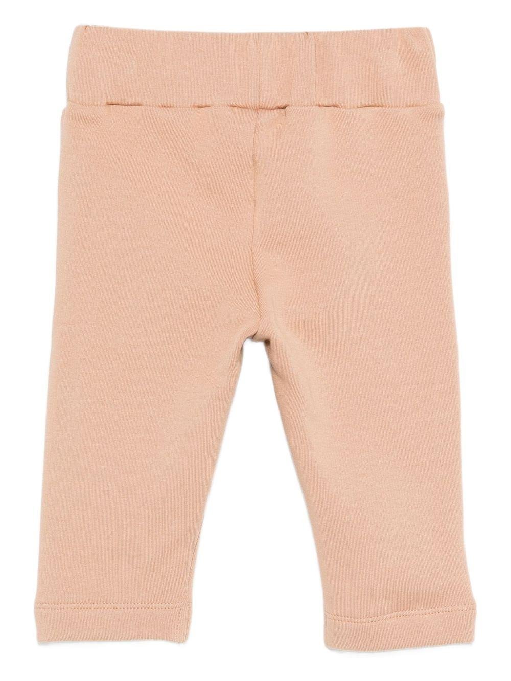 Pantaloni per neonata Donsje beige con toppa coniglio - Rubino Kids