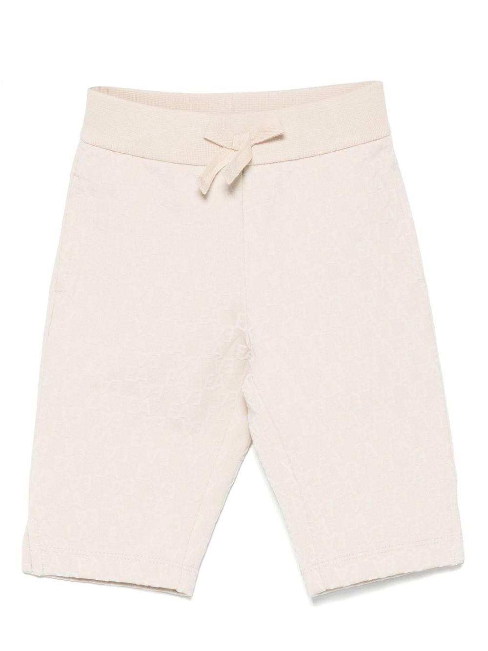Pantaloni per neonato Emporio Armani Kids beige con motivo all - over - Rubino Kids