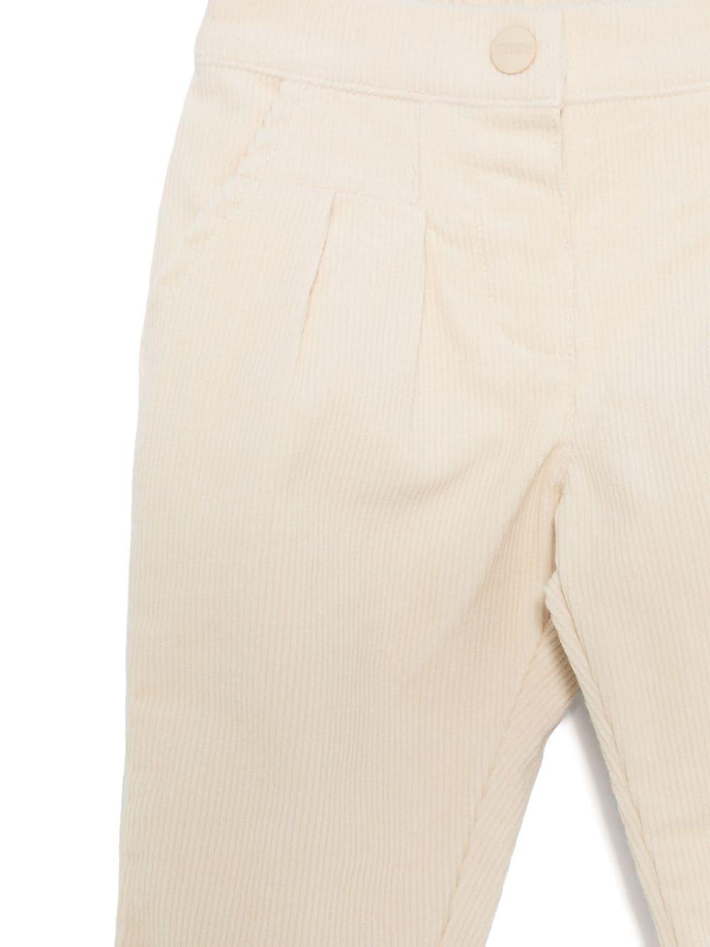 Pantaloni per neonato Moschino Kids beige chiaro a coste con logo sul retro - Rubino Kids