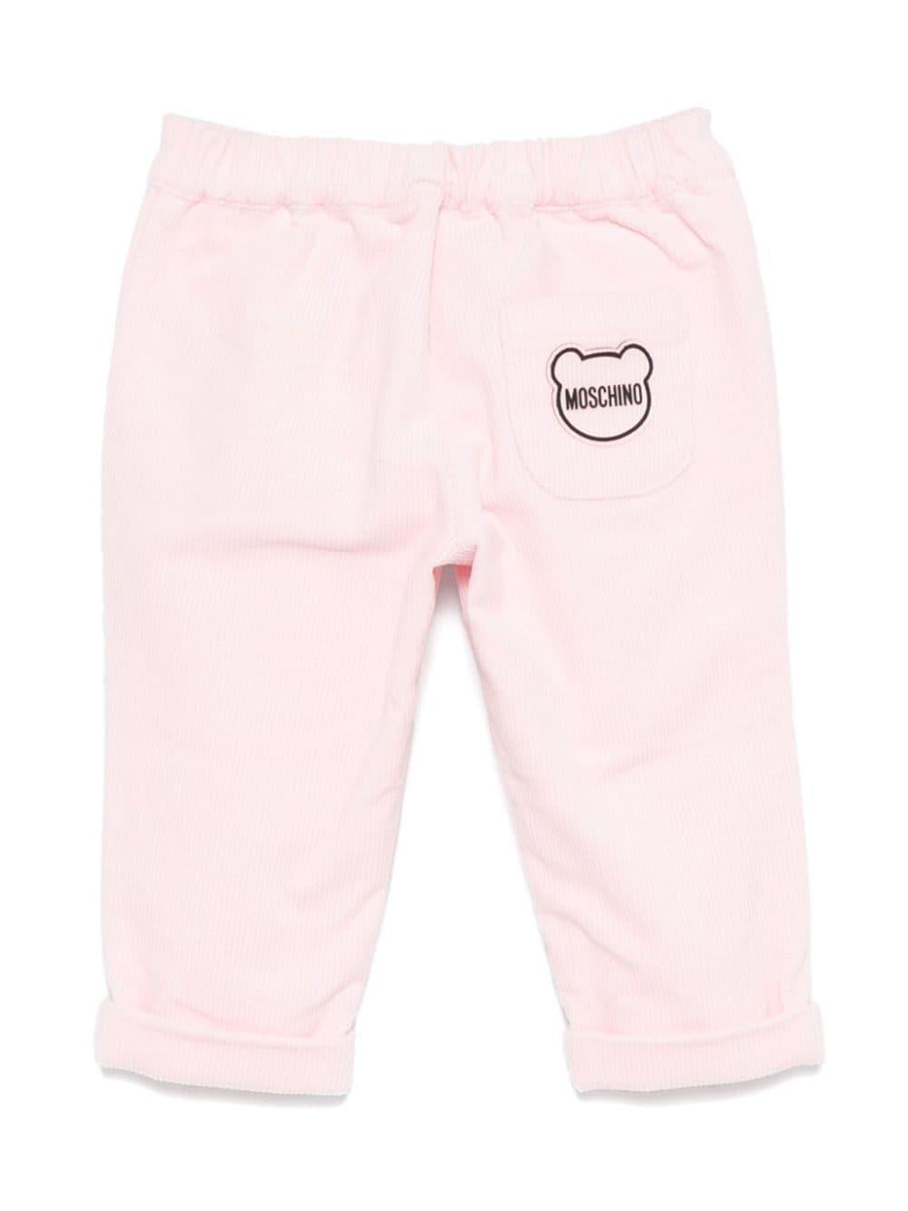 Pantaloni per neonato Moschino Kids rosa a coste con logo sul retro - Rubino Kids