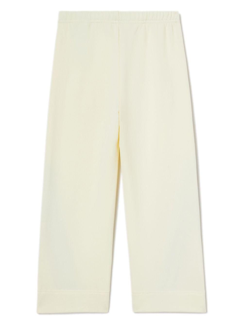 Pantaloni sportivi ampi per bambina Palm Angels Kids bianco con stampa - Rubino Kids