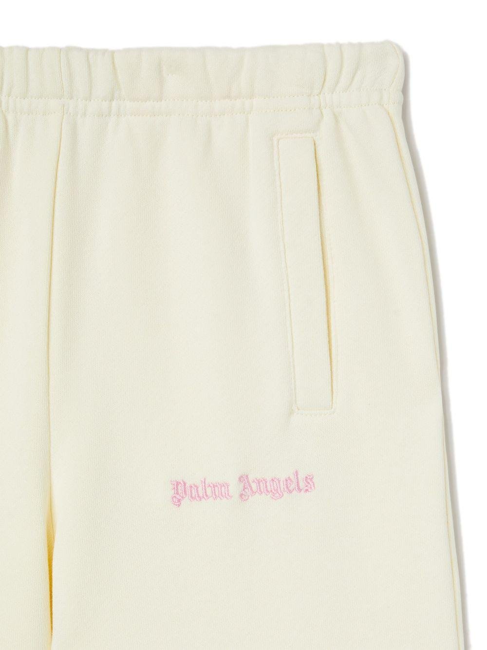 Pantaloni sportivi ampi per bambina Palm Angels Kids bianco con stampa - Rubino Kids