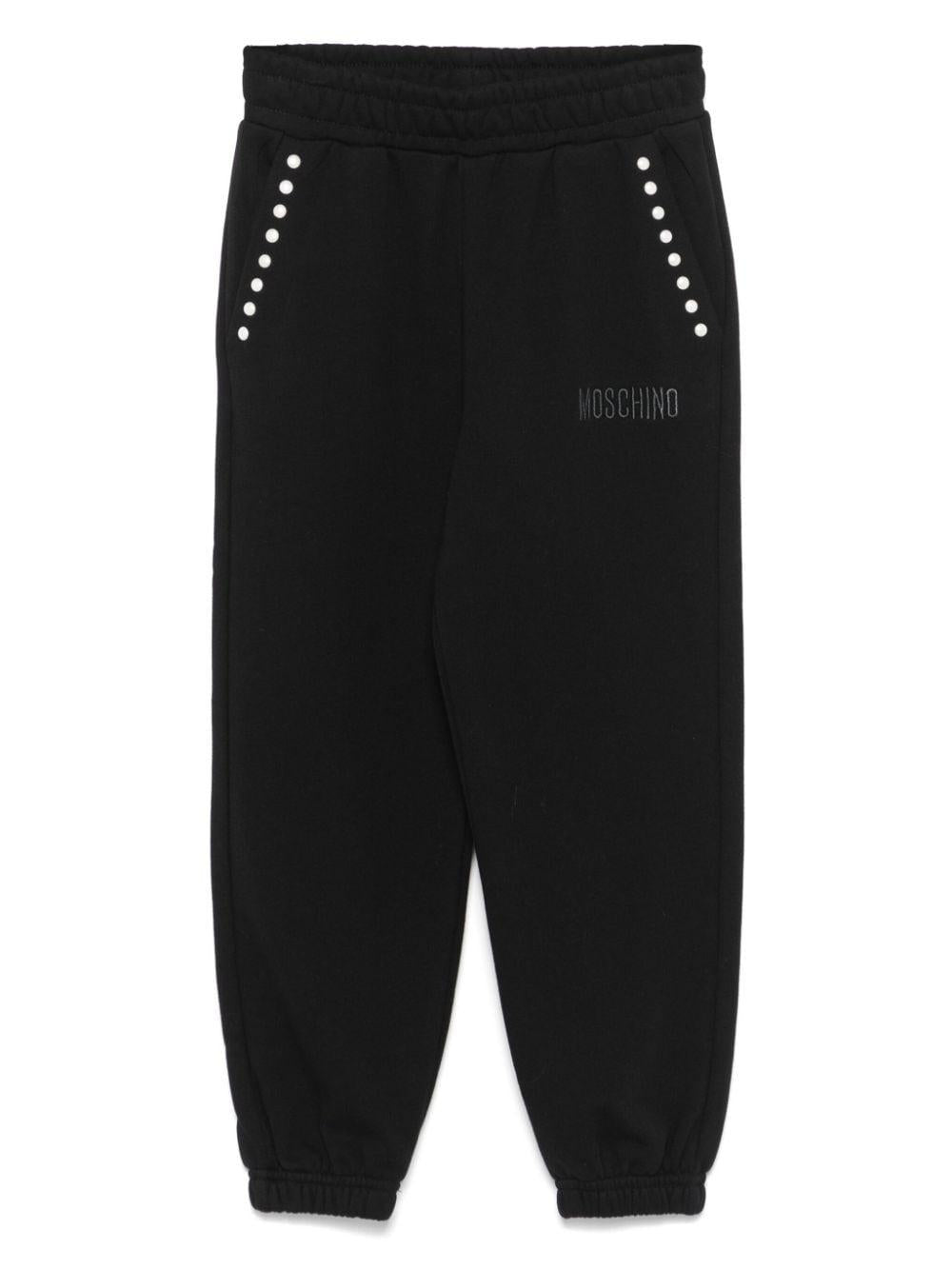 Pantaloni sportivi con borchie per bambina Moschino Kids neri con dettaglio borchiato - Rubino Kids