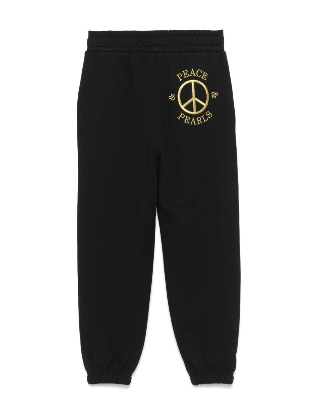Pantaloni sportivi con borchie per bambina Moschino Kids neri con dettaglio borchiato - Rubino Kids