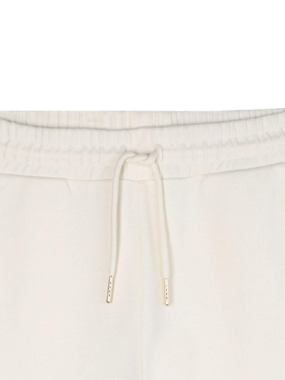 Pantaloni sportivi per bambina Michael Kors Kids bianchi con tasche cargo - Rubino Kids