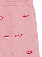 Pantaloni sportivi per bambina Stella McCartney Kids rosa con stampa bacio - Rubino Kids