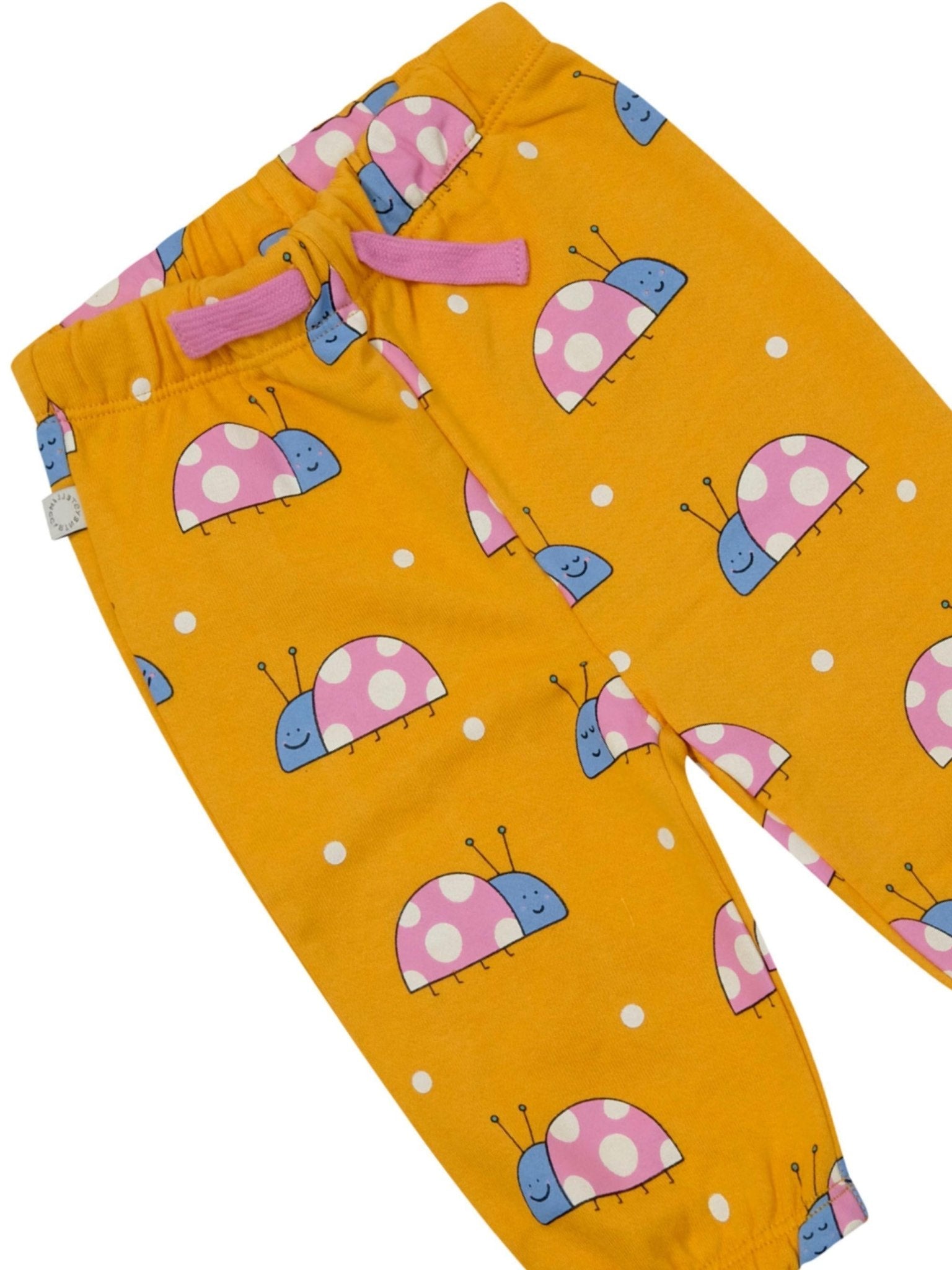 Pantaloni sportivi per neonata Stella McCartney Kids arancione con stampa coccinelle all - over - Rubino Kids