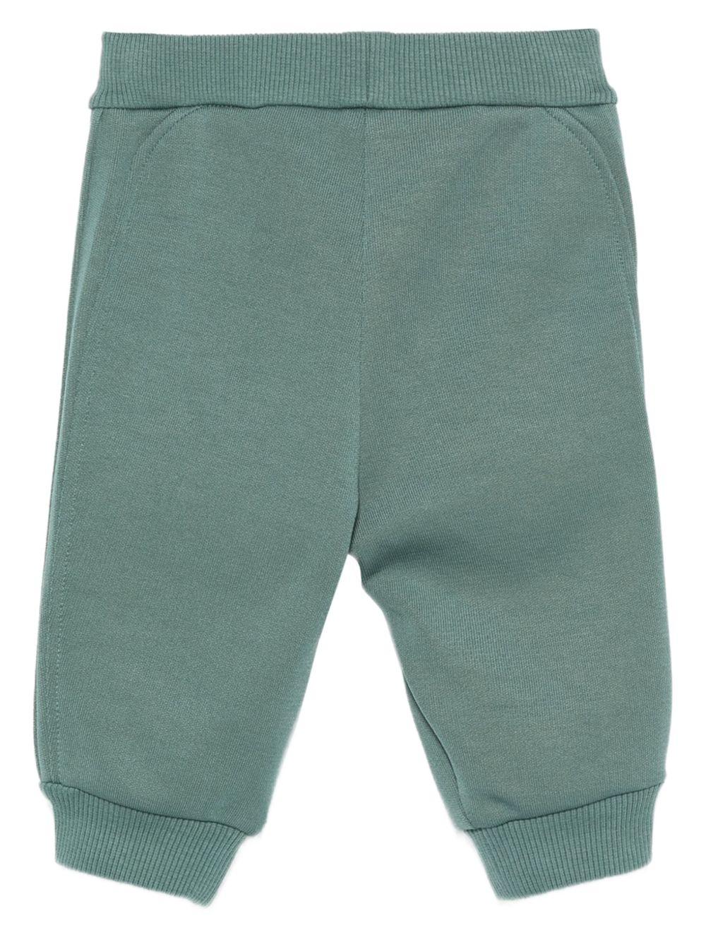 Pantaloni sportivi per neonato Emporio Armani Kids verdi con logo in rilievo - Rubino Kids