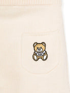 Set cardigan e pantaloni per neonati Moschino Kids beige con design lavorato a maglia - Rubino Kids