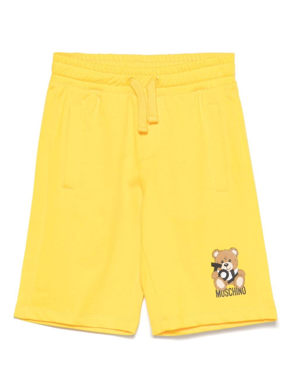 Shorts con stampa Leo Teddy per bambino Moschino Kids giallo con vita elasticizzata - Rubino Kids