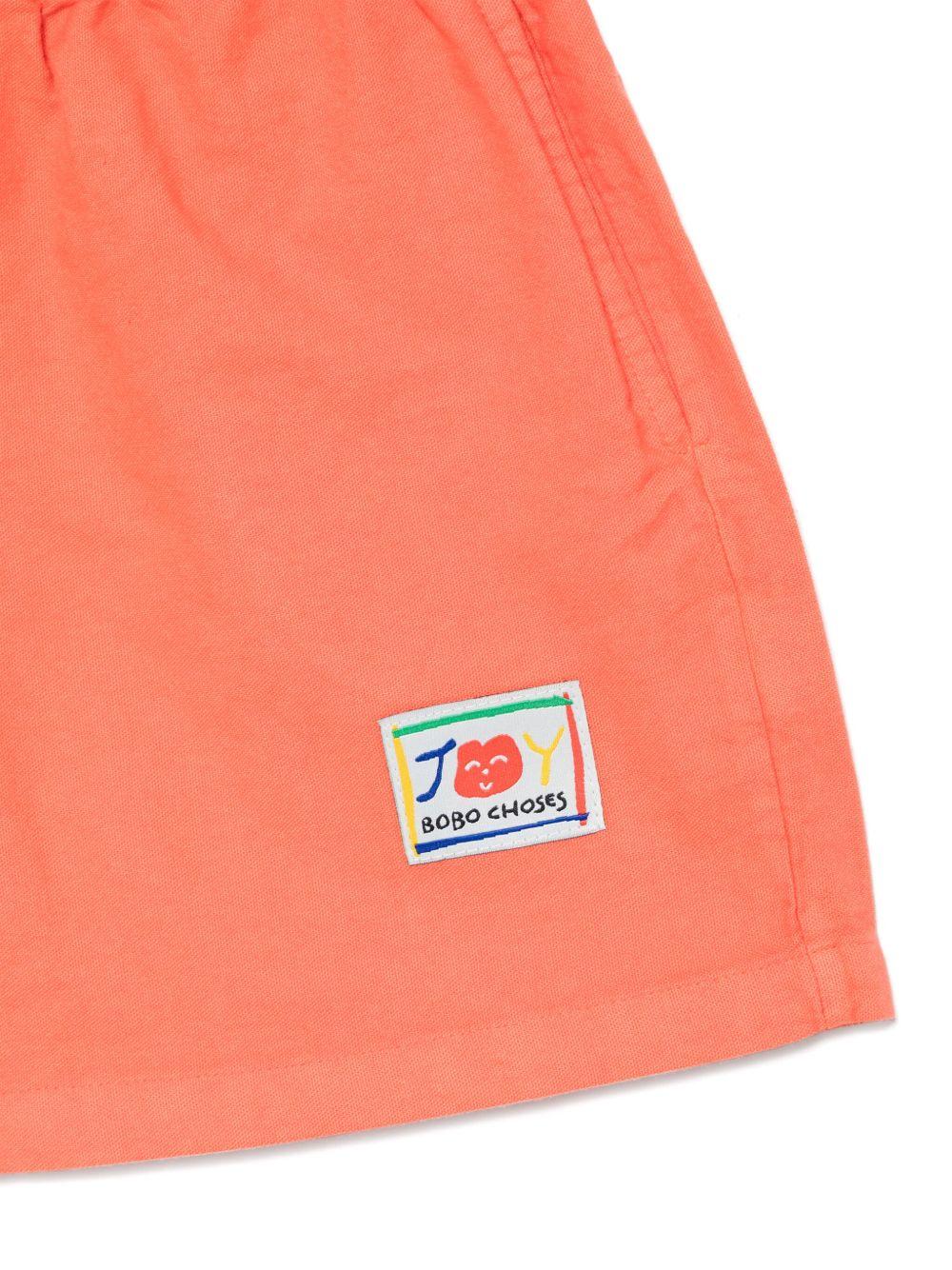 Shorts per bambino Bobo Choses Similing arancione con logo applicato - Rubino Kids