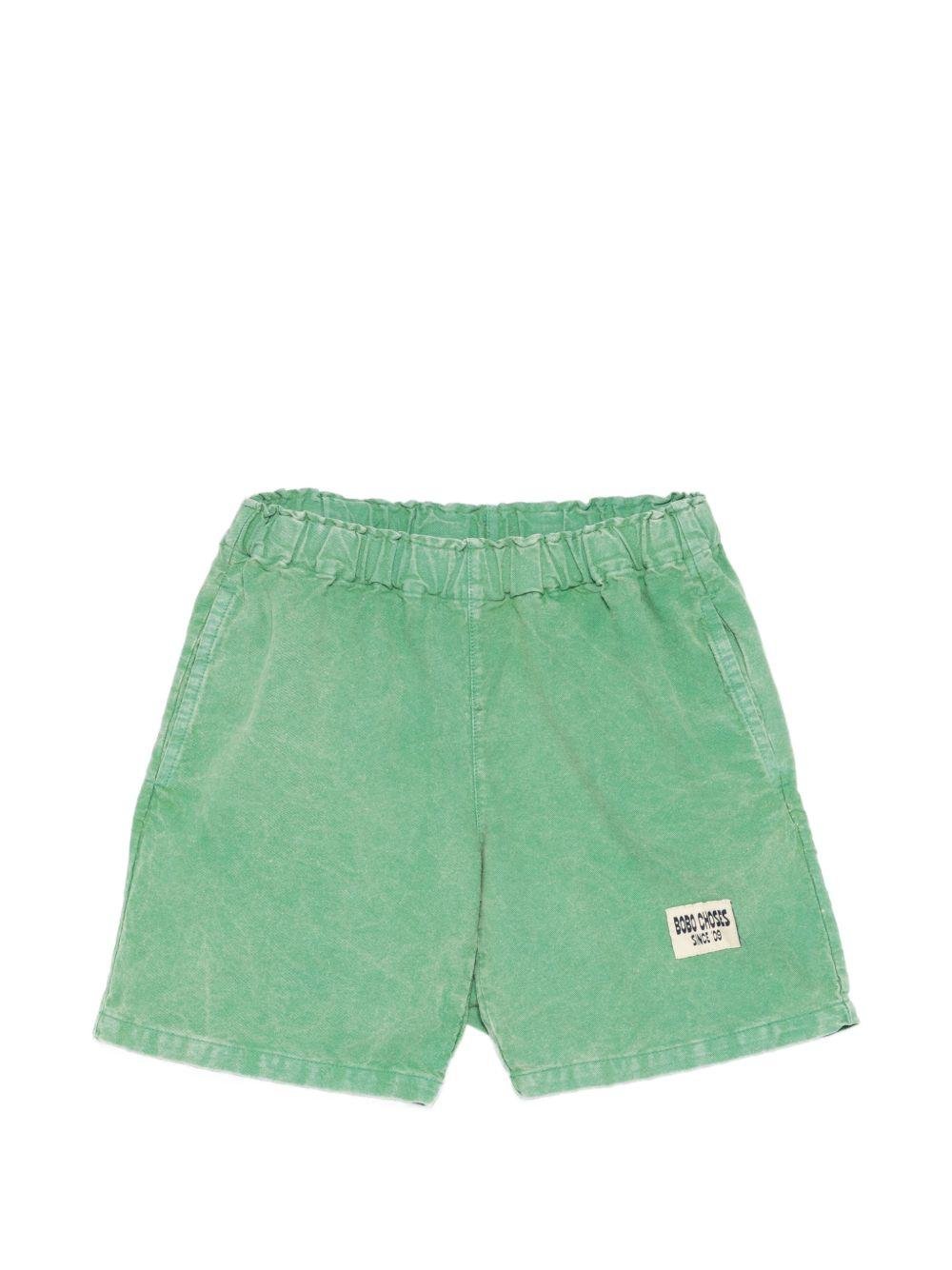 Shorts per bambino Bobo Choses verde con toppa con logo sul davanti - Rubino Kids