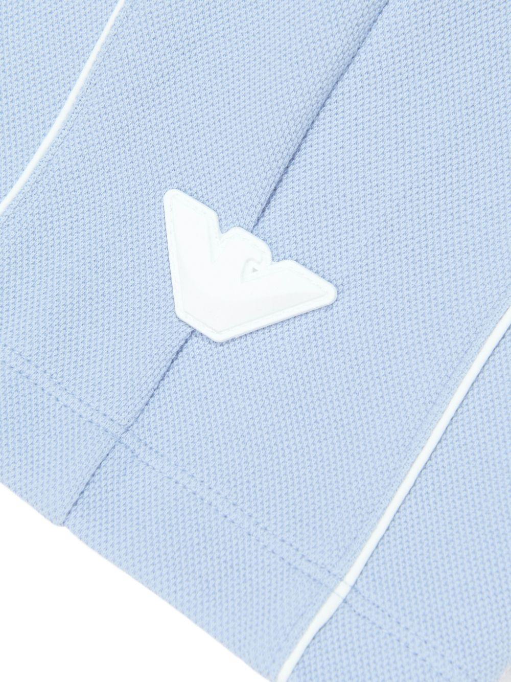 Shorts per bambino Emporio Armani Kids azzurri con logo aquila sul davanti - Rubino Kids