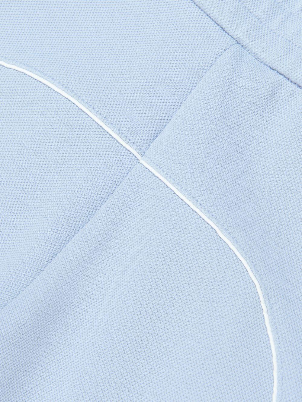 Shorts per bambino Emporio Armani Kids azzurri con logo aquila sul davanti - Rubino Kids