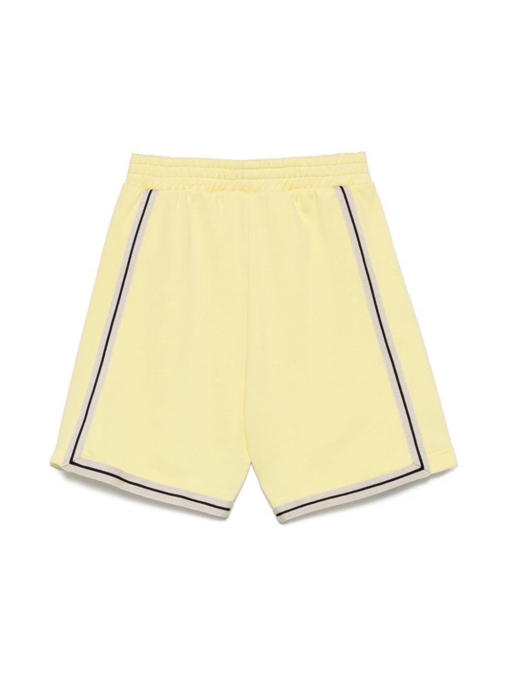 Shorts sportivi con stampa per bambino Palm Angels Kids giallo con spacchetti laterali - Rubino Kids