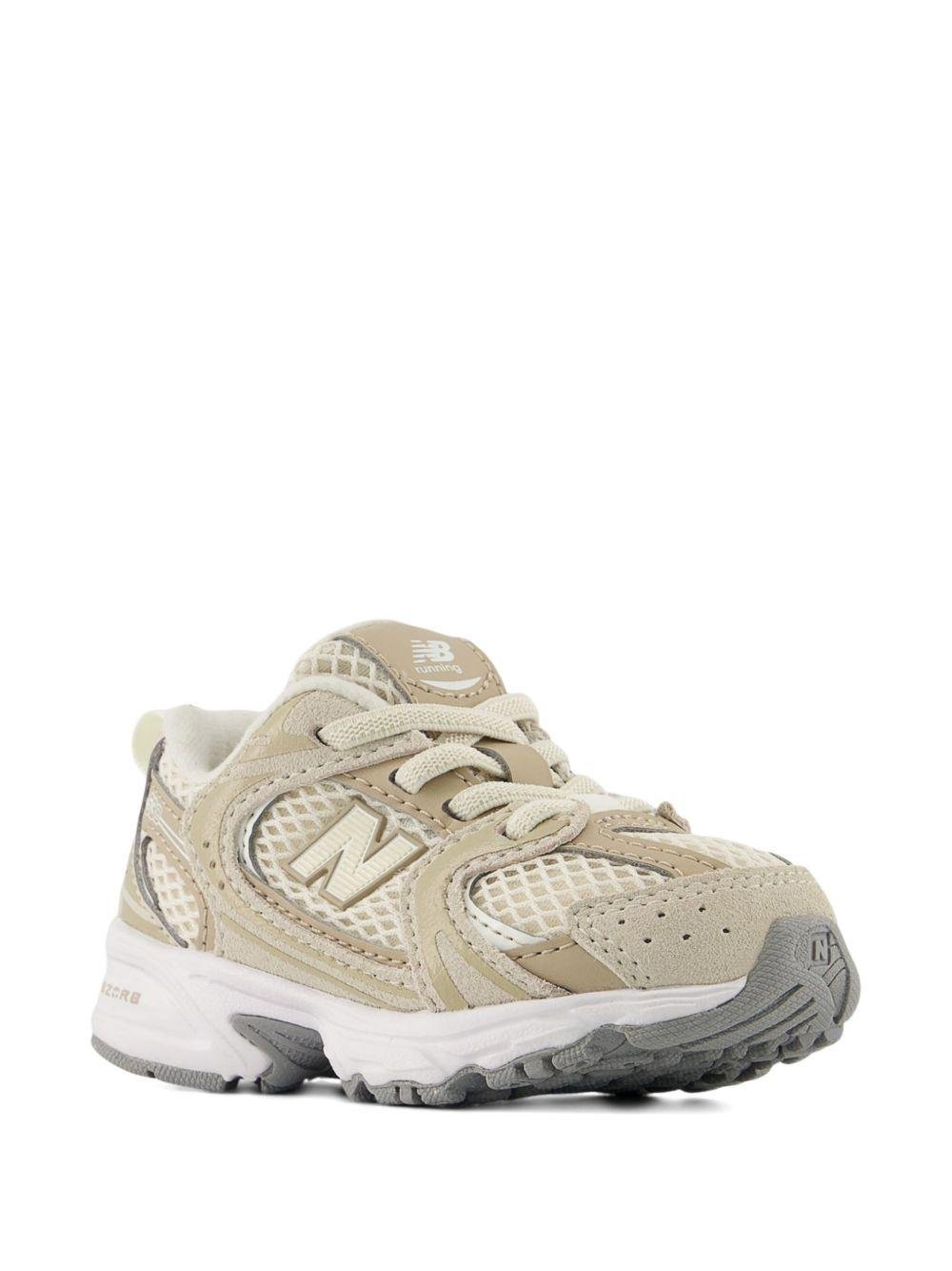 Sneakers 530 per bambini New Balance Kids beige con design a inserti - Rubino Kids