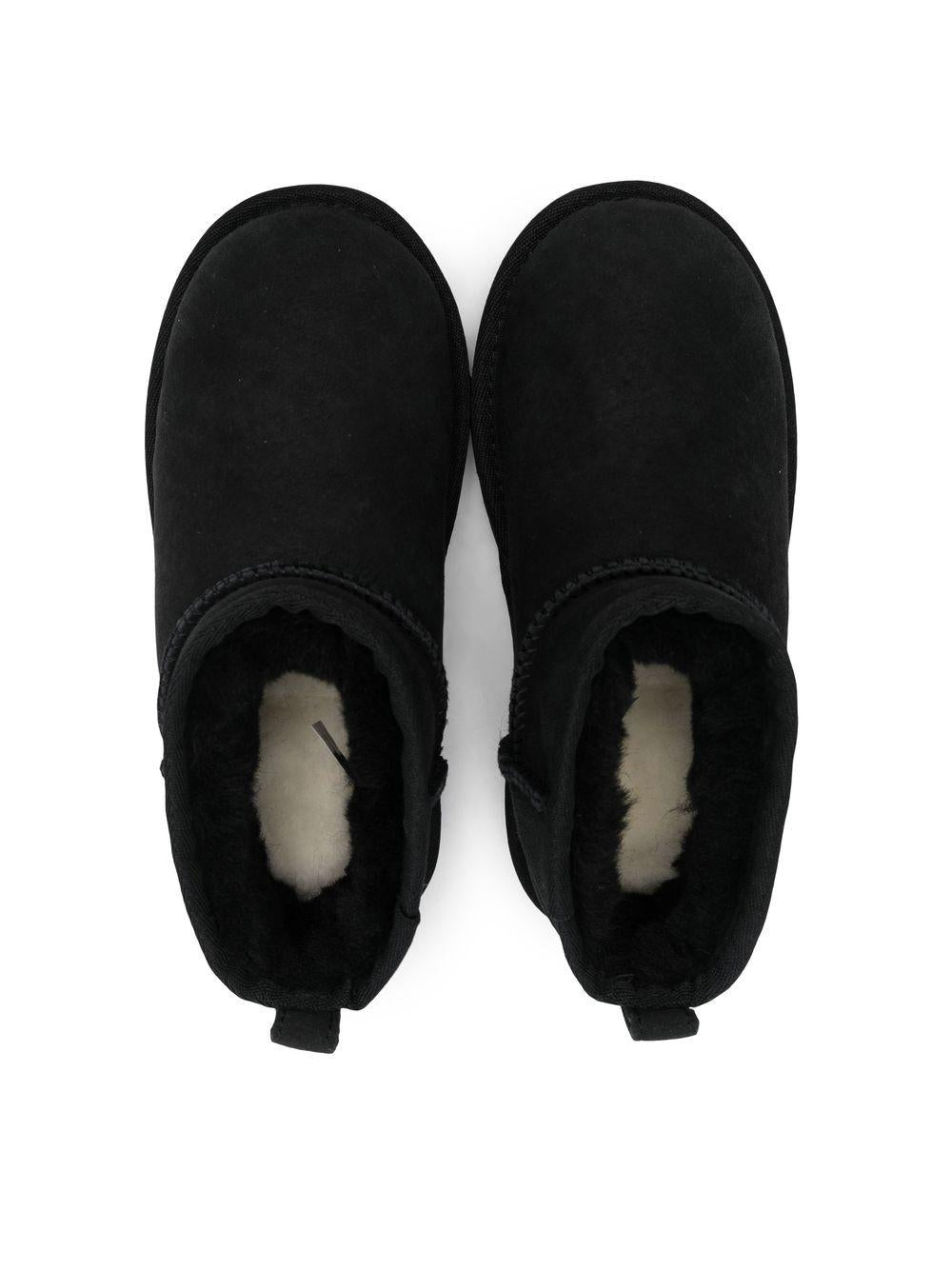 Stivali Ultra Mini per bambina UGG Kids neri con finitura idrorepellente<BR/> - Rubino Kids