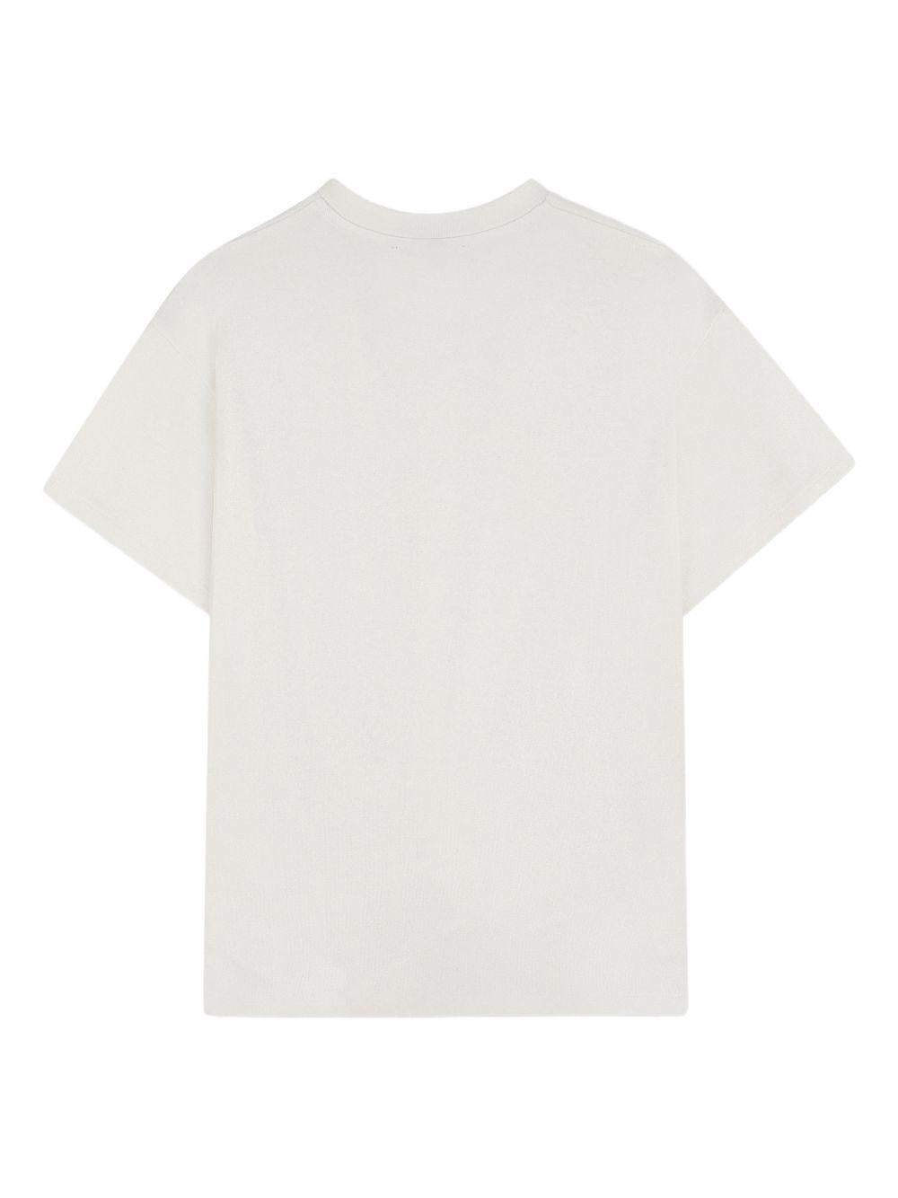 T-shirt per bambina DKNY Kids bianca con design attorcigliato - Rubino Kids