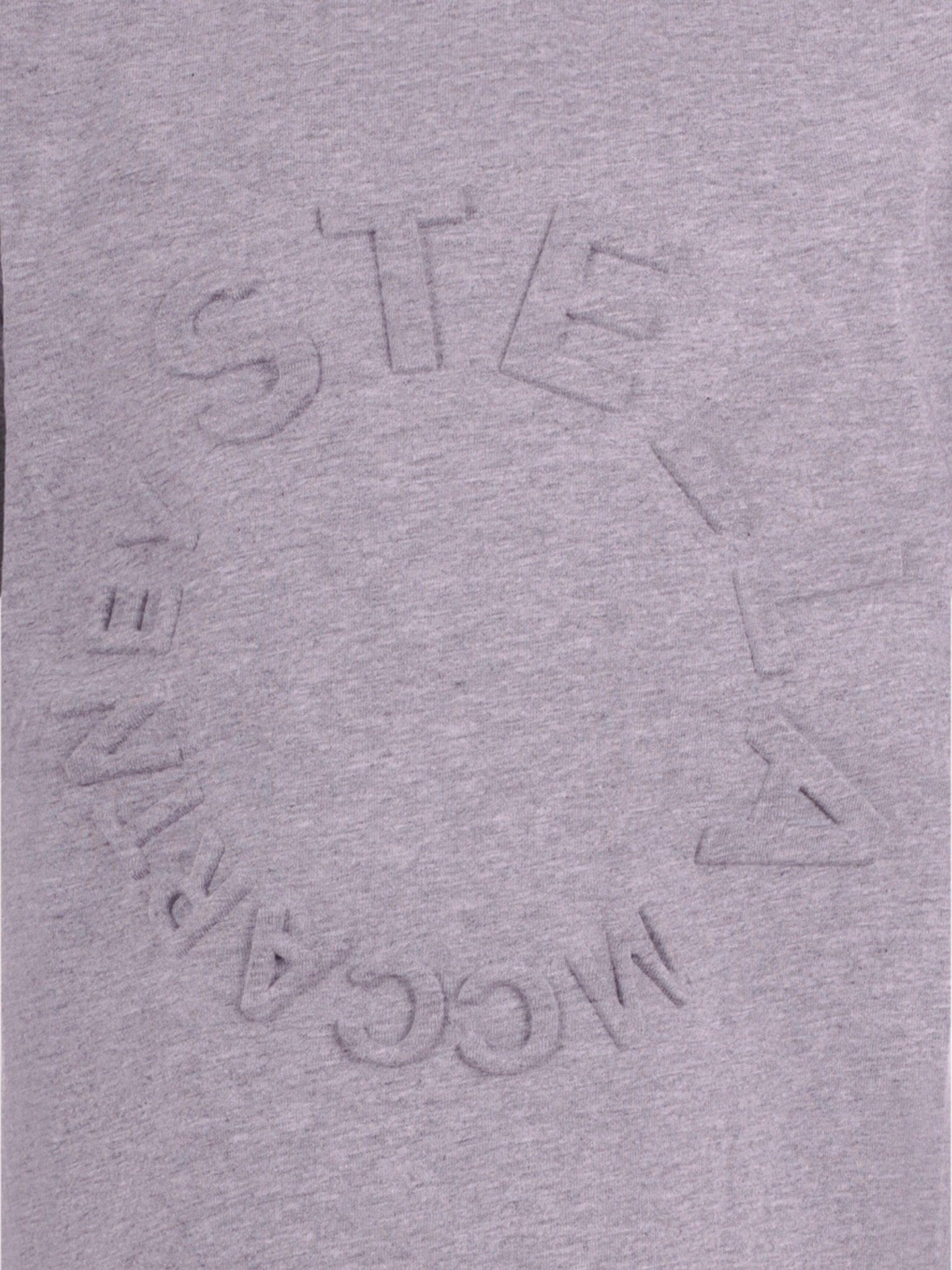 T-shirt per bambina Stella McCartney Kids grigia con logo goffrato sul davanti - Rubino Kids