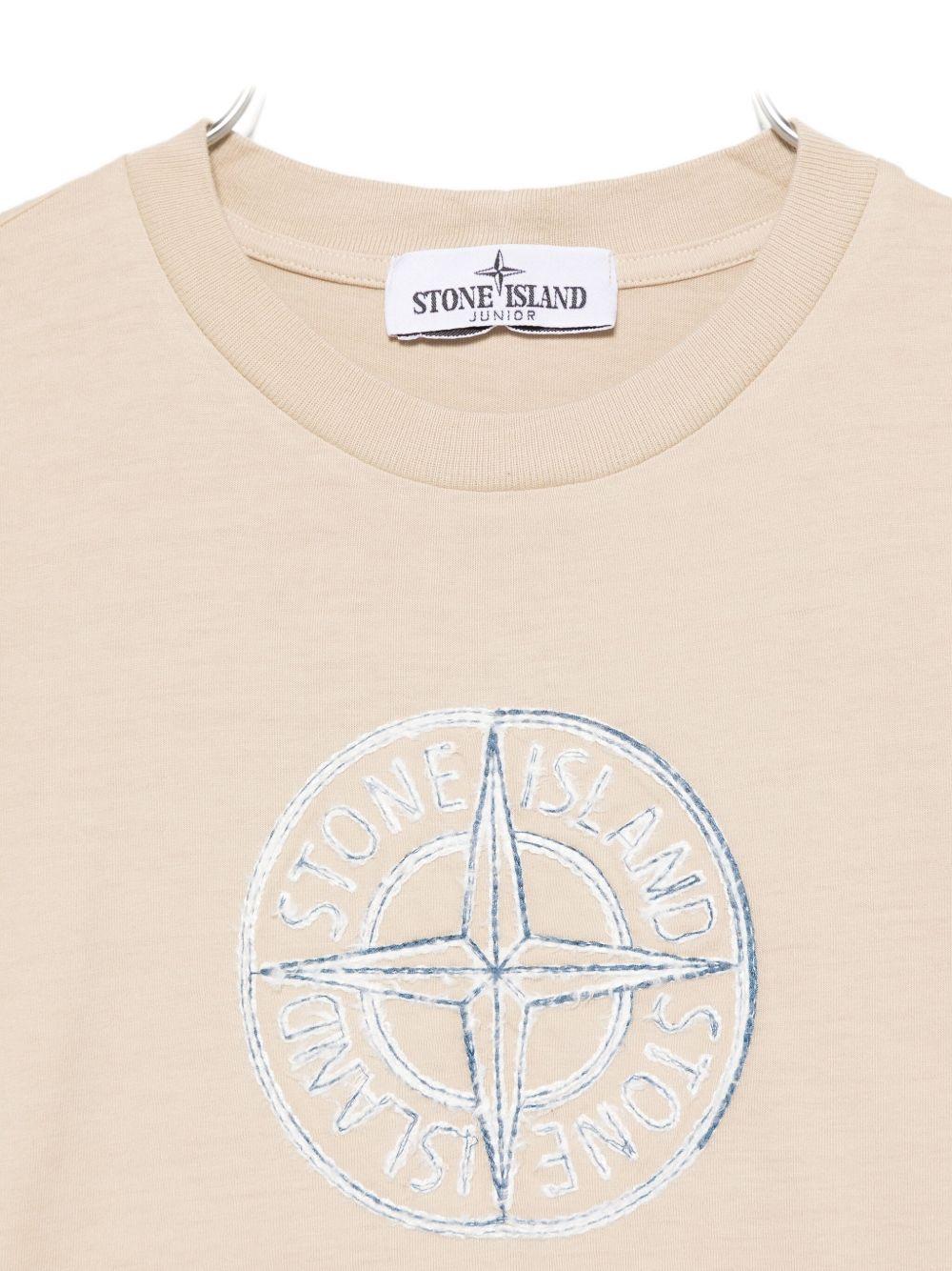 T-shirt per bambino Stone Island Junior beige con caratteristico logo sul davanti - Rubino Kids