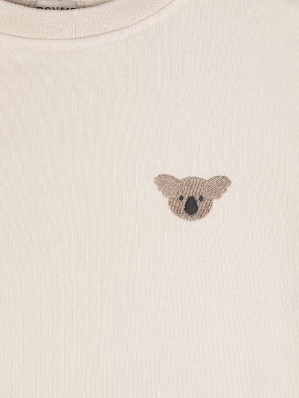 T-shirt per neonata Donsje Jarne beige con ricamo sul petto - Rubino Kids