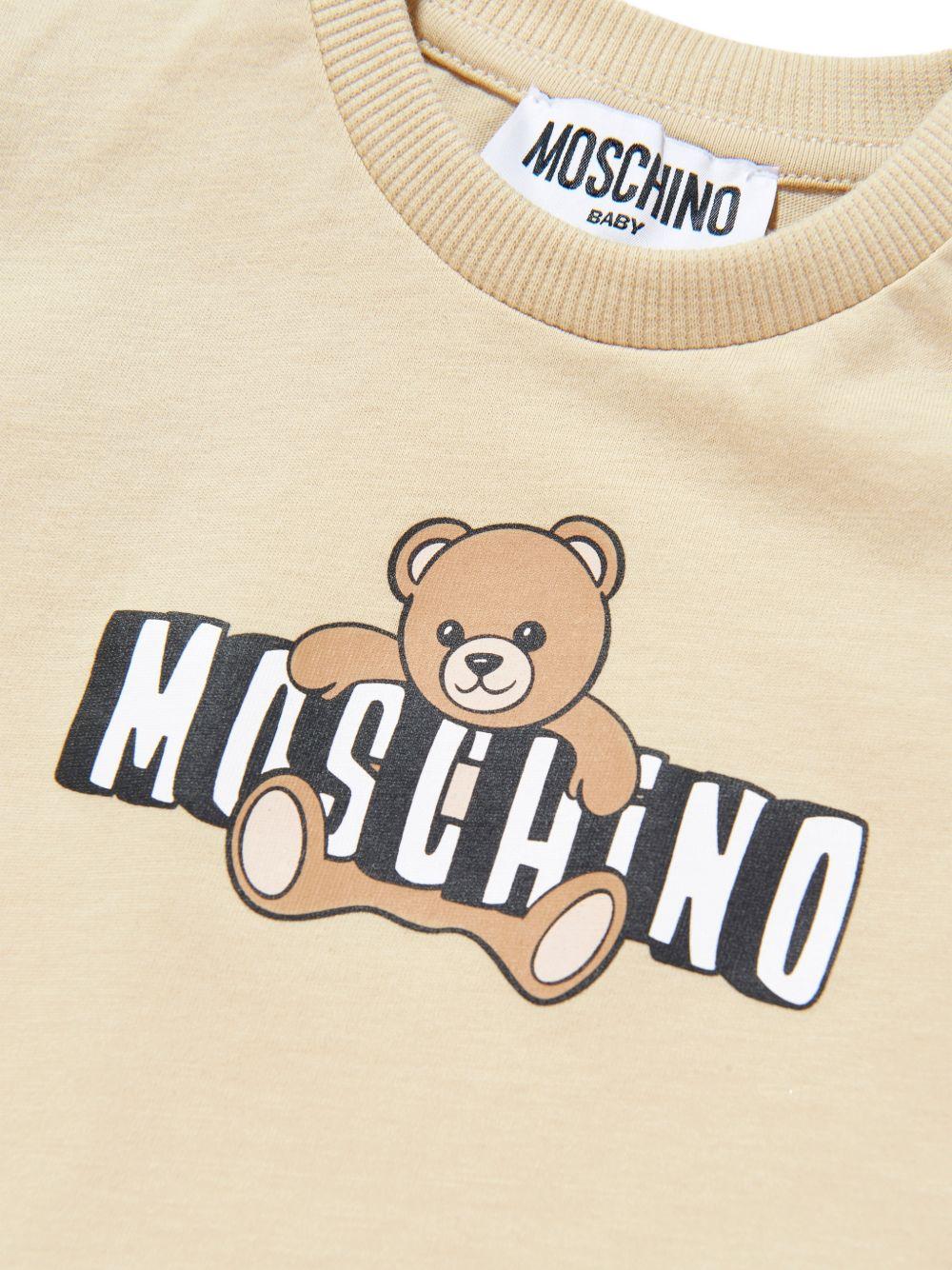 T-shirt per neonati Moschino Kids beige con logo sul davanti - Rubino Kids