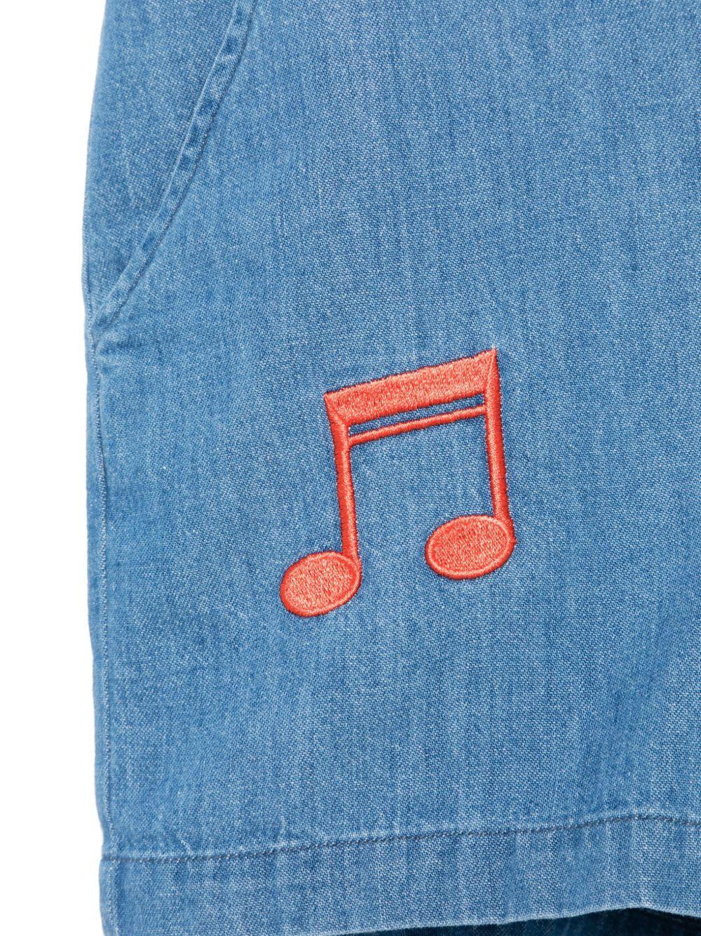 Tuta corta per bambina in denim con ricamo e due tasche diagonali laterali - Rubino Kids