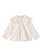 Blusa per bambina Donsje Mellys beige con dettagli ruches e colletto con pettorina - Rubino Kids