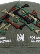 Cappello per bambino Amiri Kids verde con ossa ricamate sul davanti - Rubino Kids