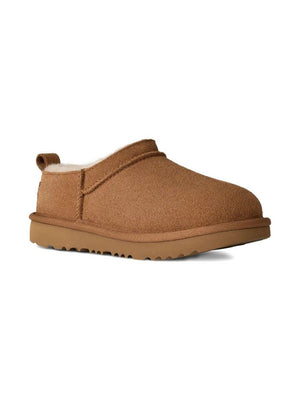UGG Kids Classic Micro Slides for girls in brown with signature logo appliqué