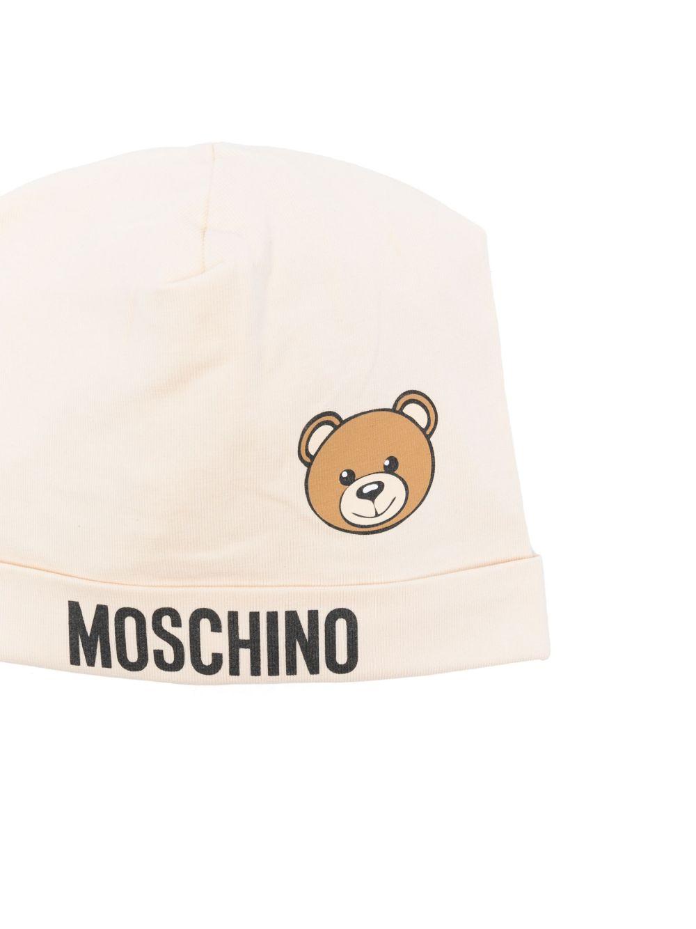 Cappello per neonato Moschino Kids beige con stampa logo e Teddy Bear MUX05ALBA00 20404 MOSCHINO KIDS 