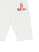 Leggins per neonata Moschino Kids bianchi con logo sul davanti MDP03JLBA00 10063 MOSCHINO KIDS 